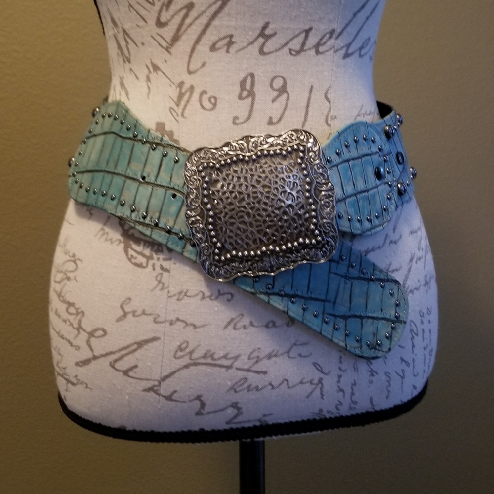 Wide turquoise belt with silver studs.